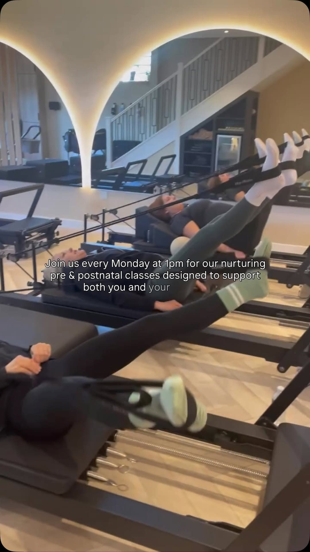 Baby YU — two women lying on reformers with legs raised